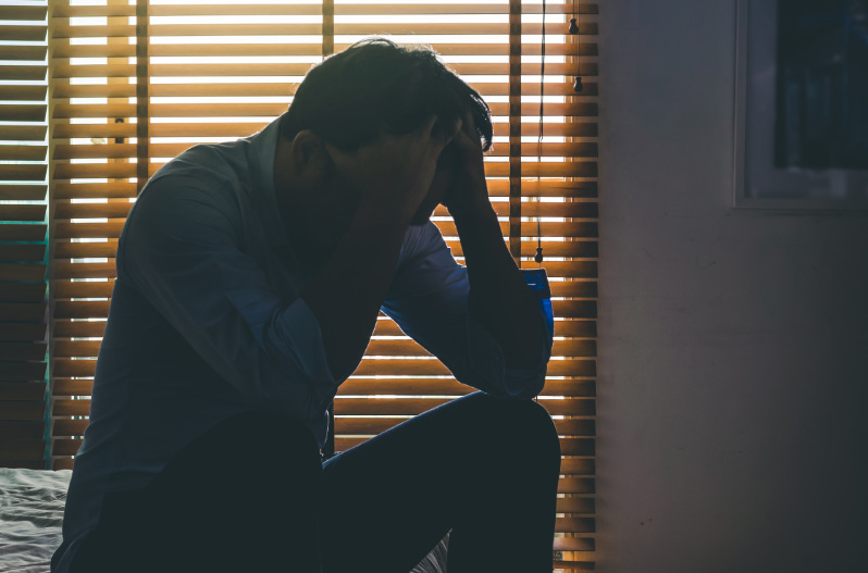 Person coping with the grief of an unattended death in the family